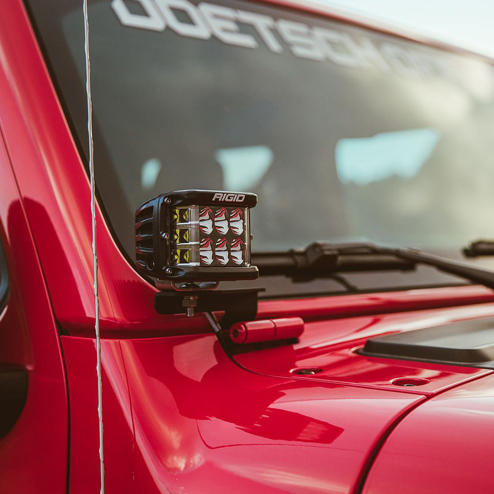 Rigid LED light bar mounted on red Jeep, off-road lighting upgrade for vehicle customization