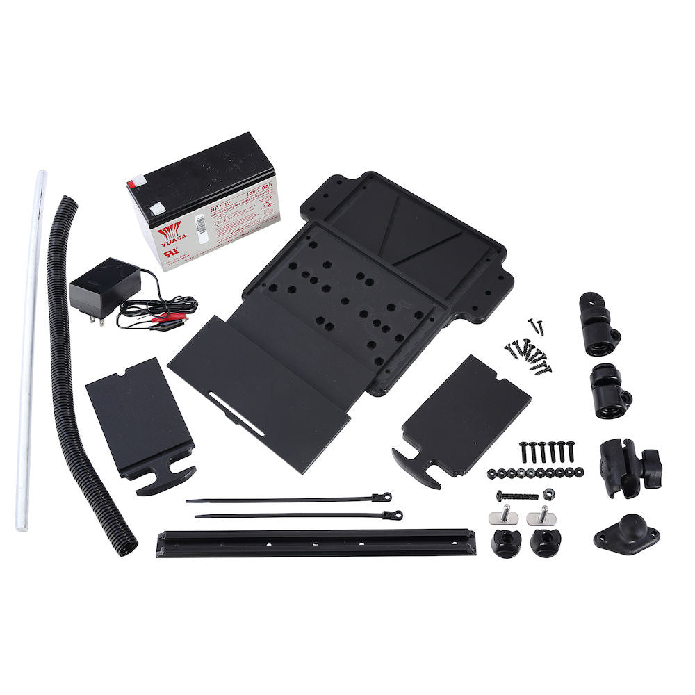 Car audio installation kit with Yuasa battery, mounting brackets, wiring, and hardware components