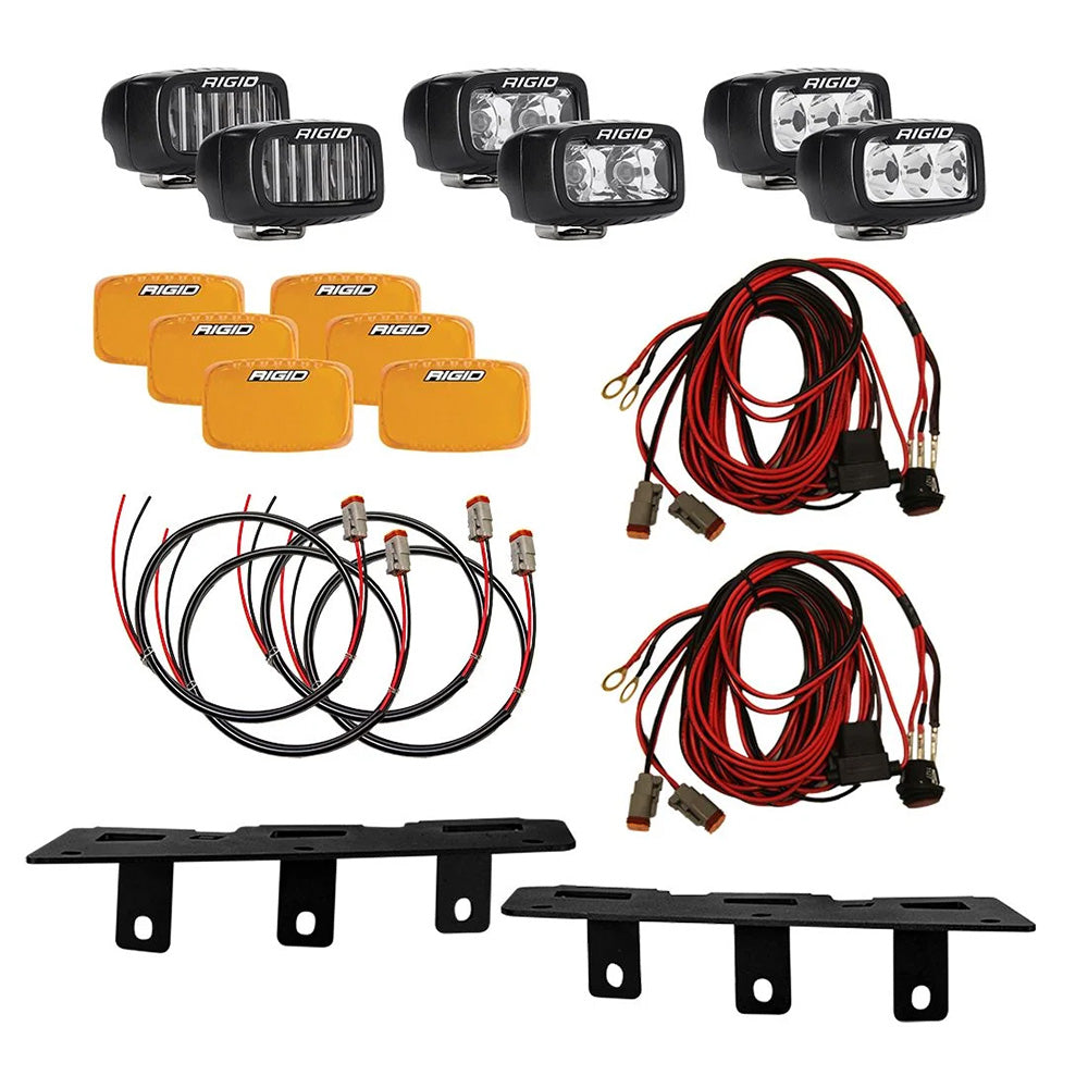 Rigid LED light pods with amber lenses, wiring harnesses, and mounting brackets for vehicle off-road lighting