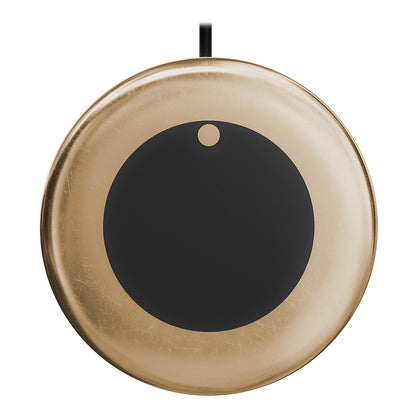 Gold wireless charging pad with black center and power cable
