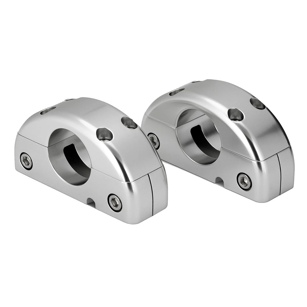Polished aluminum motorcycle handlebar mounts with bolt holes for secure installation