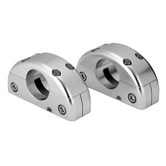 Polished aluminum motorcycle handlebar mounts with bolt holes for secure installation