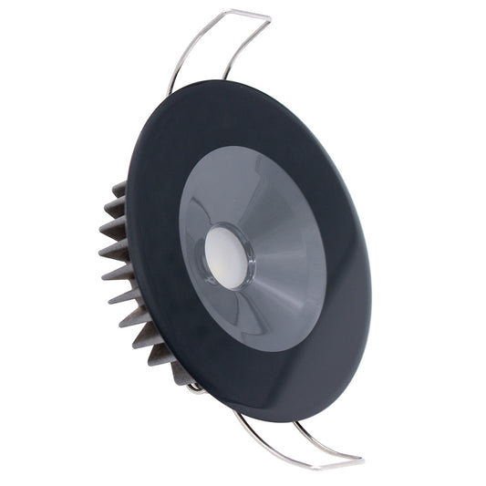 Black LED recessed light with heat sink fins and mounting clips for auto or home installation