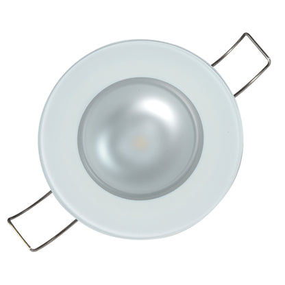 White LED recessed light fixture with metal mounting clips for residential or commercial installation