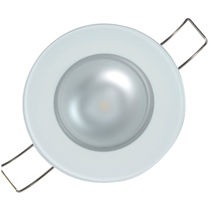 White LED recessed light fixture with metal mounting clips for residential or commercial installation