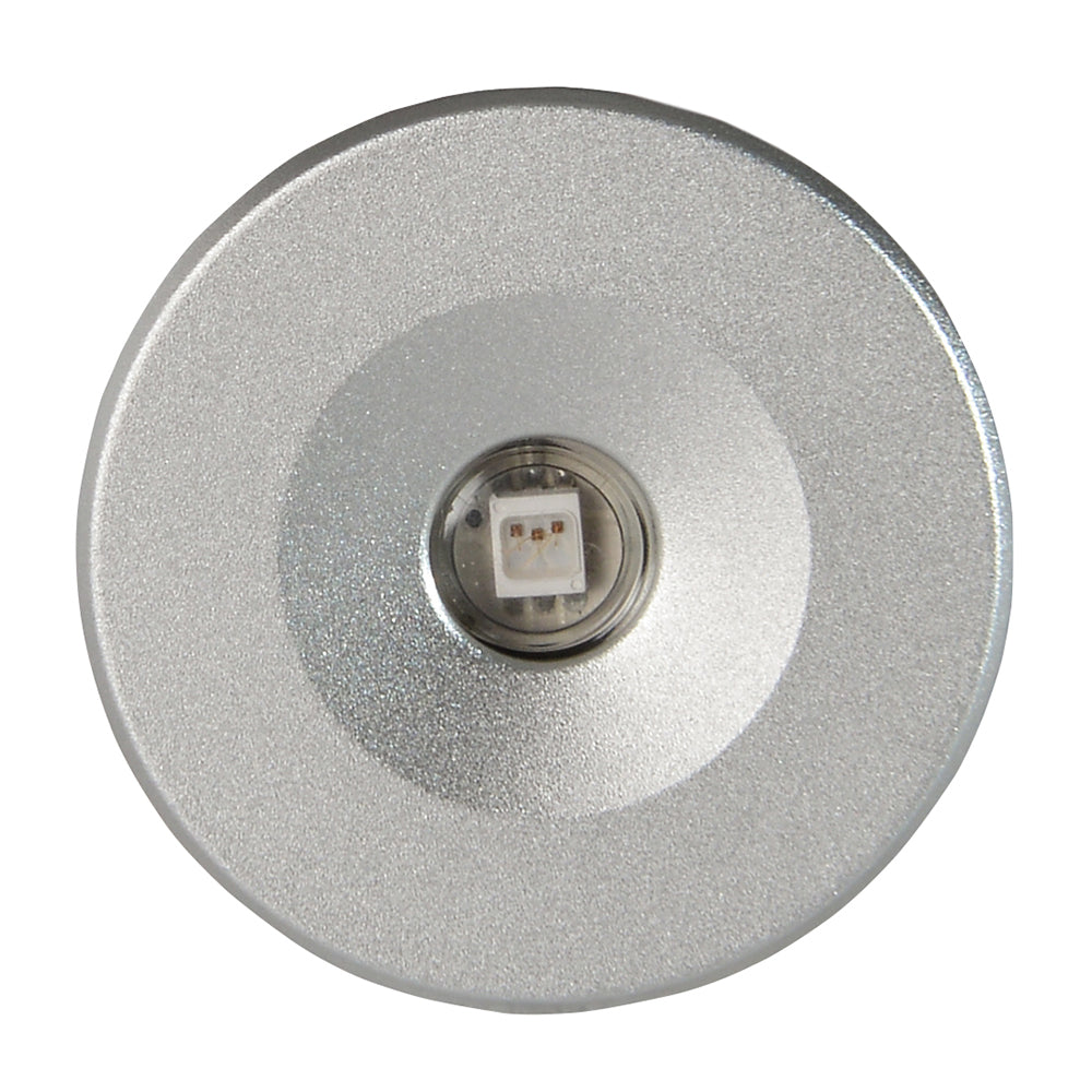 Compact silver LED puck light with central diode, ideal for auto or residential accent lighting