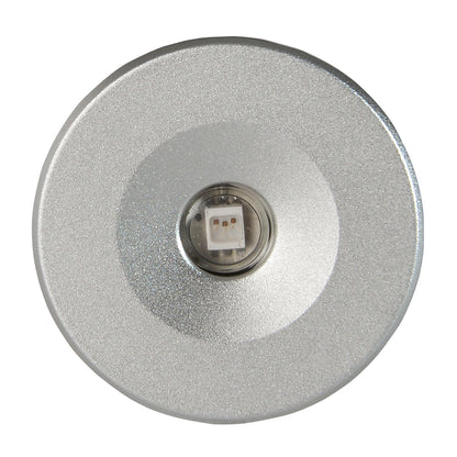 Compact silver LED puck light with central diode, ideal for auto or home accent lighting