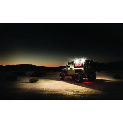 Jeep with bright LED lights and red underglow in desert at dusk, showcasing off-road lighting setup
