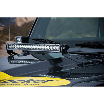 Rugged LED light bar mounted on black off-road vehicle hood, perfect for 4x4 adventures and night driving.