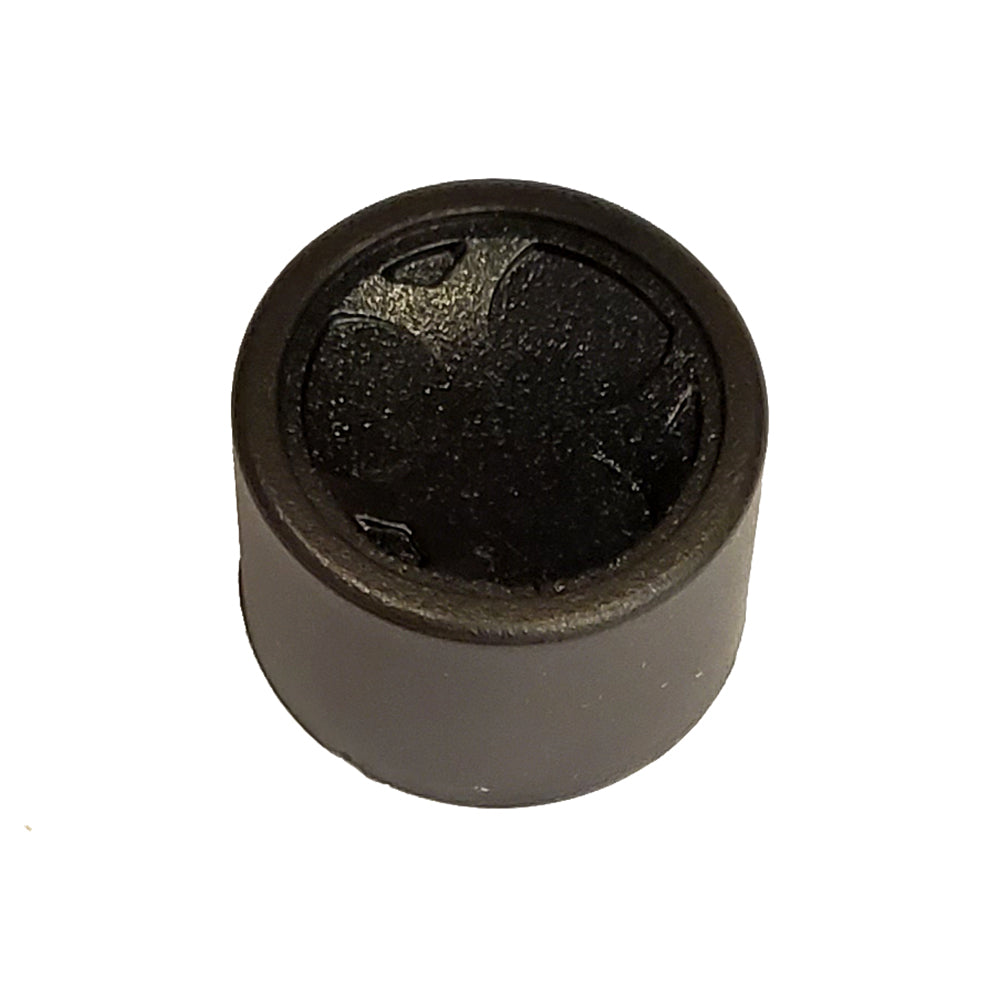 Black rubber grommet with textured center for auto audio installation