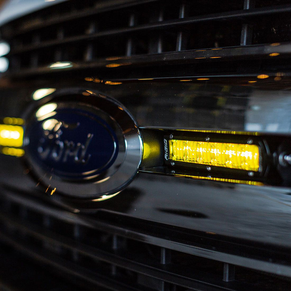 Ford grille with Rigid LED light bar installed, showcasing custom auto lighting upgrade