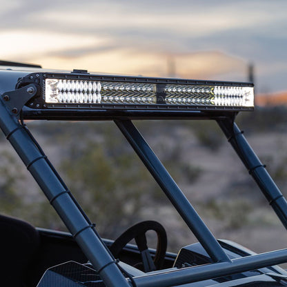 LED light bar mounted on off-road vehicle roll cage for desert driving illumination