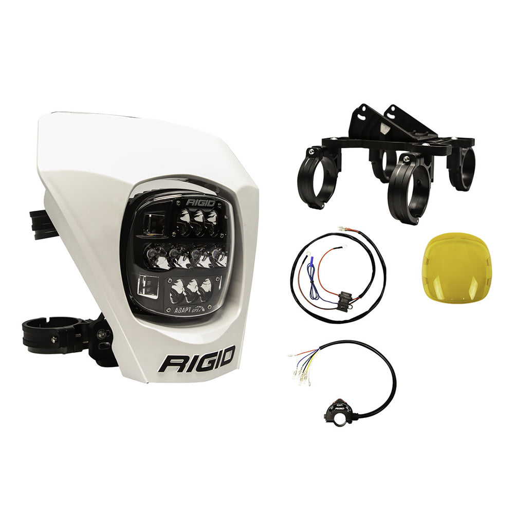 Rigid Adapt LED light kit with mounting brackets, wiring harness, and yellow lens for off-road vehicle lighting